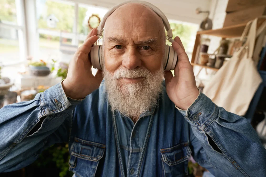 older man listening to music.